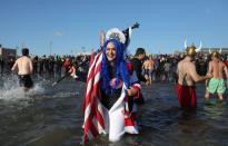 <p>Participants are seen in the water during a polar bear plunge at the beach in Coney Island, Brooklyn on Jan. 1, 2018. New Yorkers took part in new year’s day swim with temperature standing at -7 degrees Celsius. (Photo: Atilgan Ozdil/Anadolu Agency/Getty Images) </p>