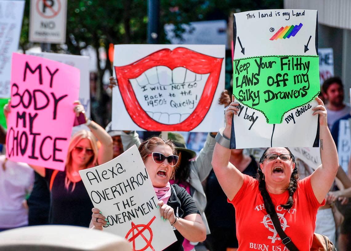 Hundreds of protesters march along Cotton Ave. Sunday during a pro-choice march and rally Sunday in downtown Macon.