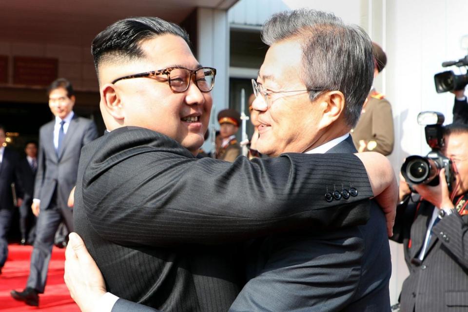 The two leaders embrace ahead of the surprise summit (AFP/Getty Images)