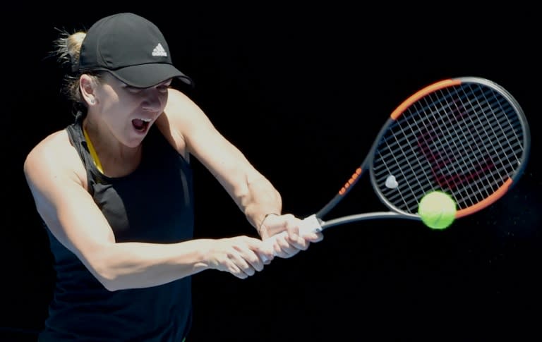 Number one women's seed, Romania's Simona Halep, hits a return during a training session ahead of the Australian Open, in Melbourne, on January 11, 2018