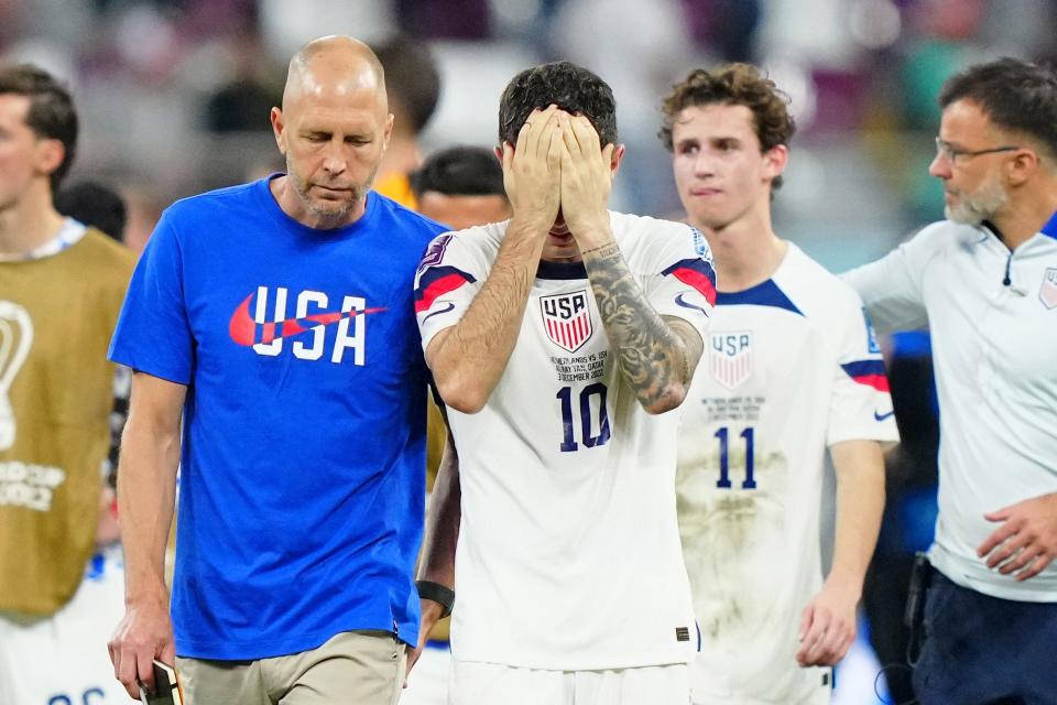 Dec 3, 2022; Al Rayyan, Qatar; United States of America manager Gregg Berhalter consoles forward Christian Pulisic (10) after losing a round of sixteen match against the Netherlands in the 2022 FIFA World Cup at Khalifa International Stadium.