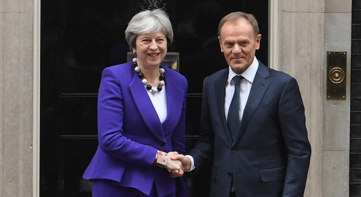 Prime Minister Theresa May greets European Council president Donald Tusk ahead of a meeting at Downing Street, London.