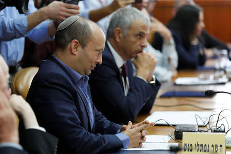 Israel's Minister of Education Naftali Bennett and Finance Minister Moshe Kahlon attend the weekly cabinet meeting in Jerusalem November 18, 2018. Abir Sultan/Pool via REUTERS/File Photo