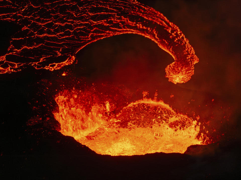 The only active crater with the lava flow emerging at it's base, near Grindavik, Iceland, April 6, 2024. The volcano in southwestern Iceland has erupted three times in the last five months. (AP Photo/Marco di Marco)