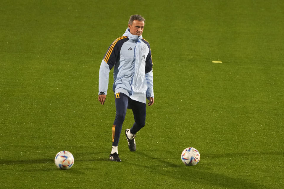 Spain's national soccer team coach Luis Enrique kicks a ball during a training session in Las Rozas, just outside Madrid, Spain, Monday, Nov. 14, 2022. The team will travel to Jordan for a friendly match on Thursday and then onto Qatar to participate in the World Cup. (AP Photo/Paul White)