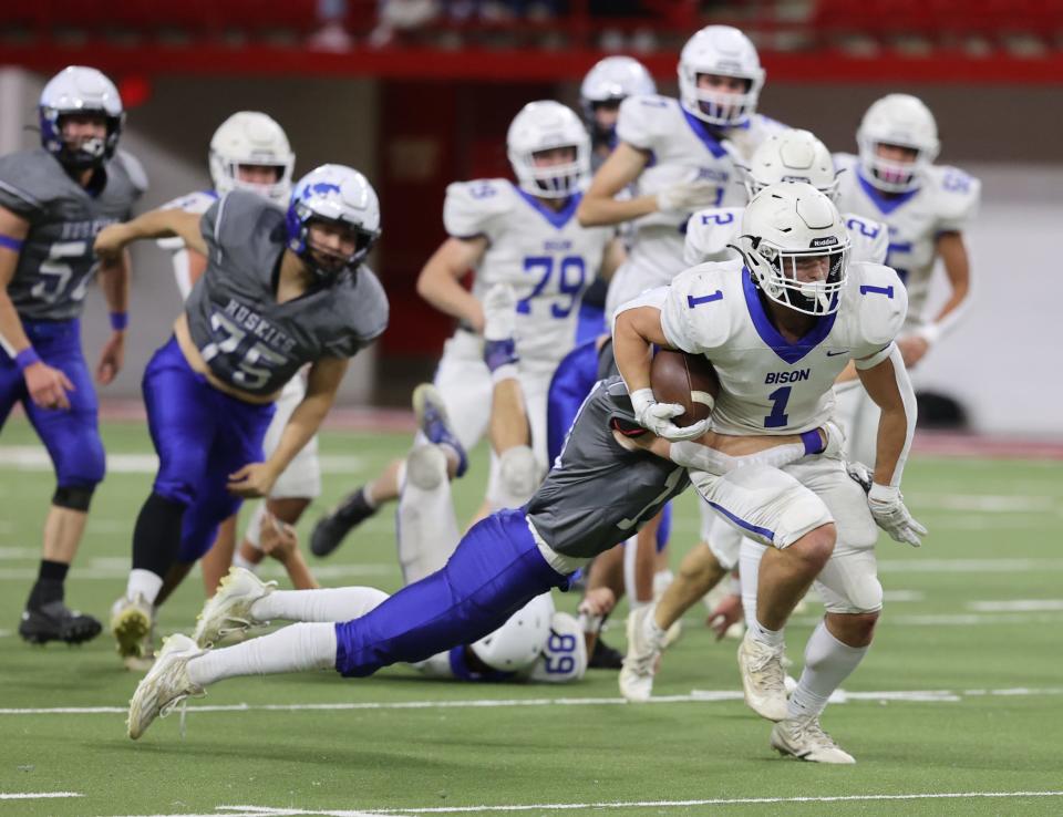 Hot Springs' Camron Maciejewski (1) picks up some rushing yardage during the state Class 11B high school football championship against Elk Point-Jefferson on Friday, Nov. 10, 2023 in Vermillion's DakotaDome.