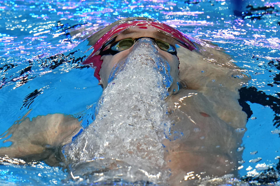 Roman Mityukov of Switzerland competes in the men's 200-meter backstroke heat at the World Aquatics Championships in Doha, Qatar, Thursday, Feb. 15, 2024. (AP Photo/Hassan Ammar)
