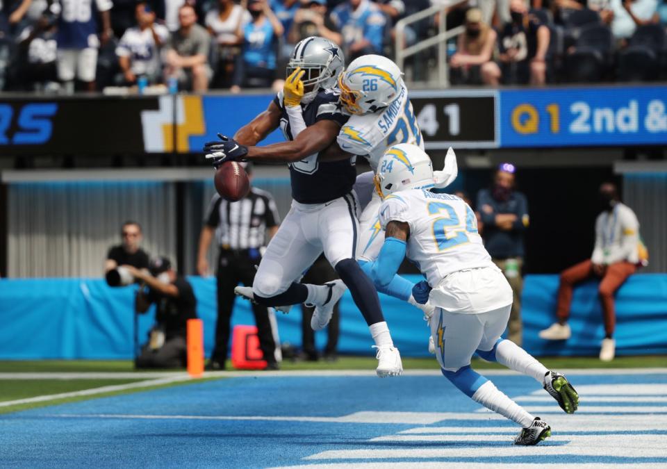 Chargers' Asante Samuel Jr. breaks up a pass intended for Cowboys receiver Amari Cooper (19) in the end zone.