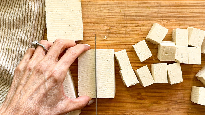 hand cutting tofu