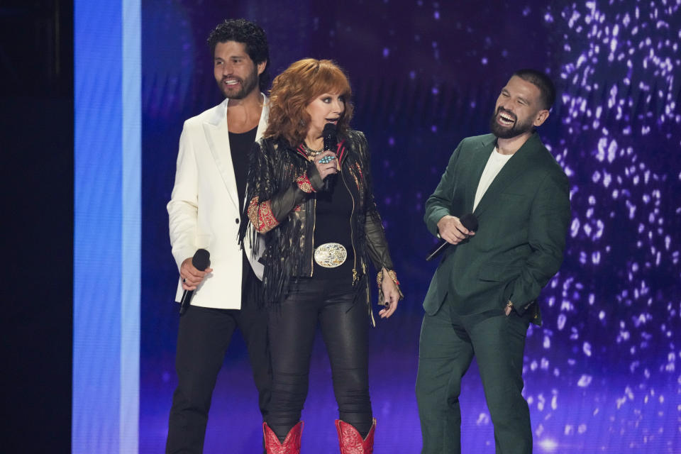 Dan Smyers of Dan + Shay, from left, Reba McEntire, and Shay Mooney of Dan + Shay introduce a performance by Miranda Lambert during the 59th annual Academy of Country Music Awards on Thursday, May 16, 2024, at the Ford Center in Frisco, Texas. (AP Photo/Chris Pizzello)