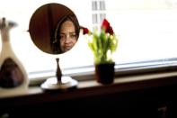 Beverly Whitfield, who says pollution from dairies creates unhealthy air in her community, stands for a portrait in her kitchen on Monday, May 20, 2024, in Pixley, Calif. She believes her allergies, her adult son's asthma and others' breathing issues are linked to pollution from nearby dairies. (AP Photo/Noah Berger)