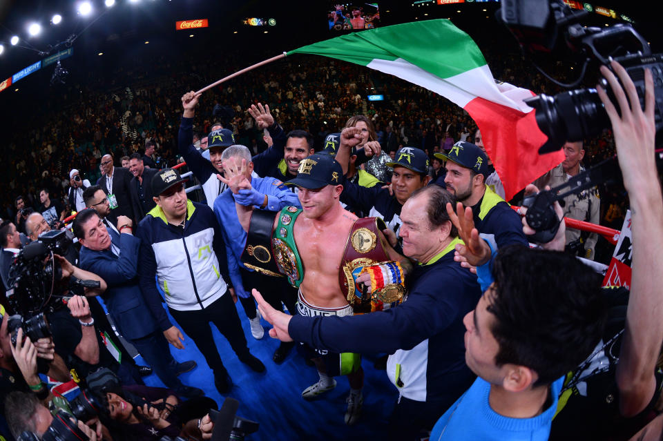 iNov 2, 2019; Las Vegas, NV, USA; Canelo Alvarez (blue/green trunks) celebrates after knocking out Sergey Kovalev (not pictured) during their WBO light heavyweight title bout at MGM Grand Garden Arena. Alvarez won via 11th round TKO. Mandatory Credit: Joe Camporeale-USA TODAY Sports