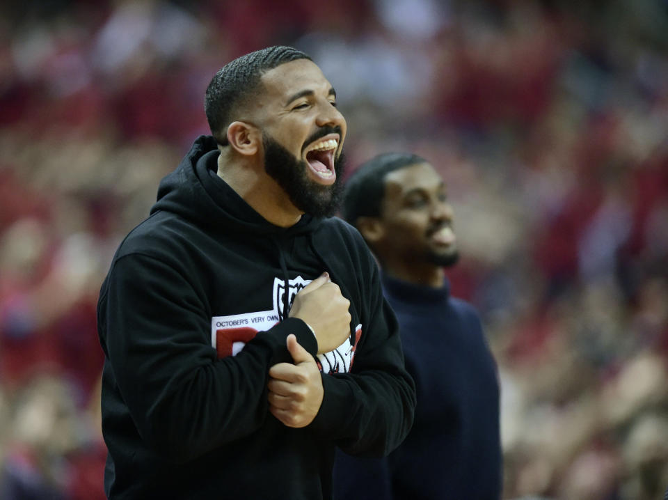 Drake smiles as he watches the Toronto Raptors take on the Milwaukee Bucks during the first half of Game 4 of the NBA basketball playoffs Eastern Conference finals, Tuesday, May 21, 2019 in Toronto. (Frank Gunn/The Canadian Press via AP)