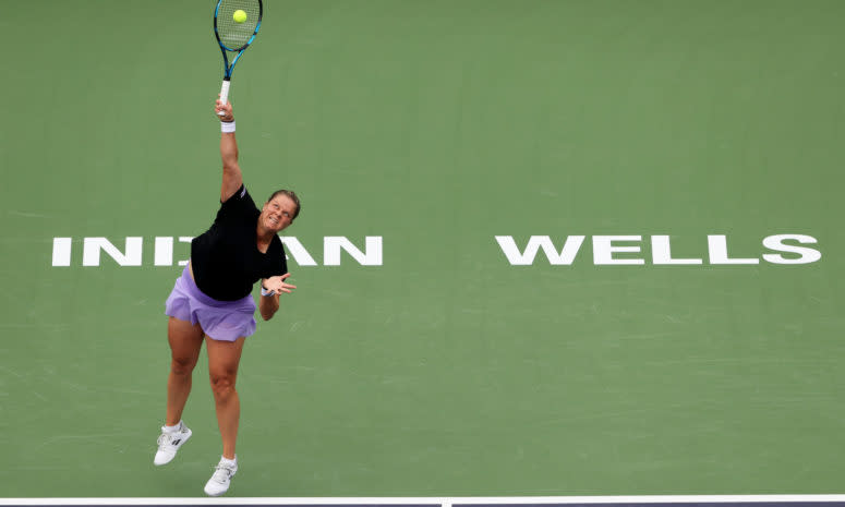 Kim Clijsters serves the ball.