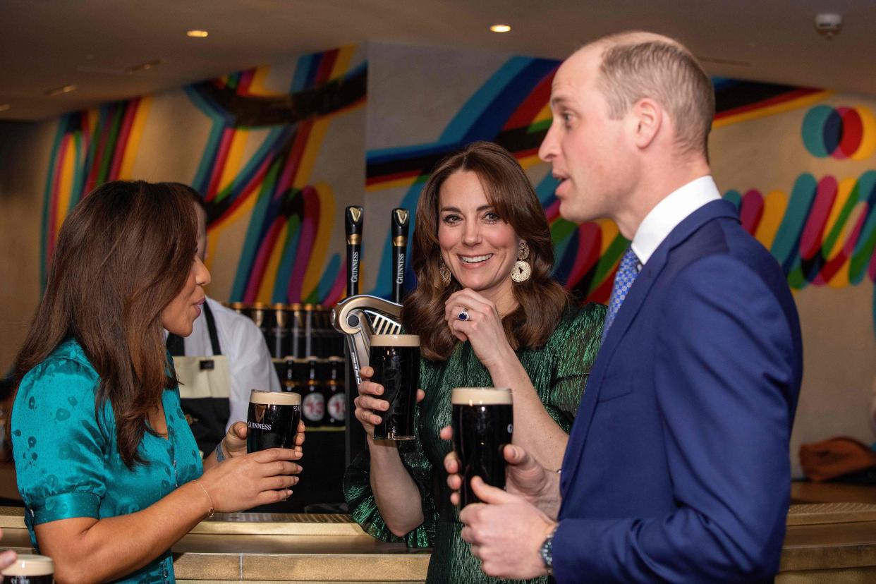 Britain's Prince William, Duke of Cambridge, and Catherine, Duchess of Cambridge, hold pints of Guinness as they attend a special reception at the Guinness Storehouses Gravity Bar in Dublin on March 3, 2020 on the first day of their Royal Highnesses three-day visit. (Photo by PAUL FAITH / various sources / AFP) (Photo by PAUL FAITH/AFP via Getty Images)