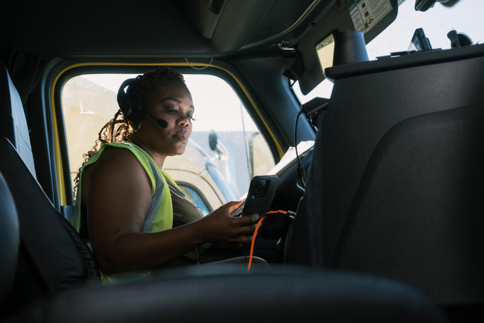 Arnesha Barron keys in information for the load she was delivering in Lebanon, Tenn., at the end of June. (Tamara  Reynolds for NBC News)