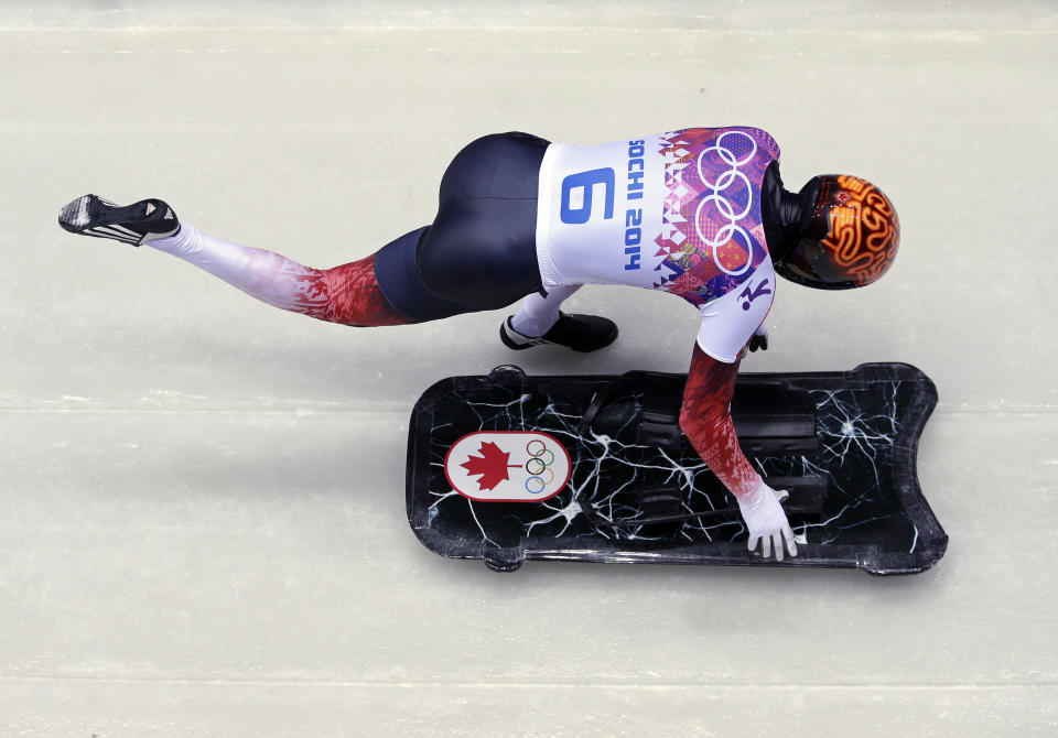 John Fairbairn of Canada starts his first run during the men's skeleton competition at the 2014 Winter Olympics, Friday, Feb. 14, 2014, in Krasnaya Polyana, Russia.