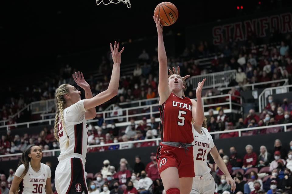 Utah guard Gianna Kneepkens (5) shoots next to Stanford forward Cameron Brink, left, during the first half of an NCAA college basketball game in Stanford, Calif., Friday, Jan. 20, 2023. (AP Photo/Godofredo A. Vásquez)