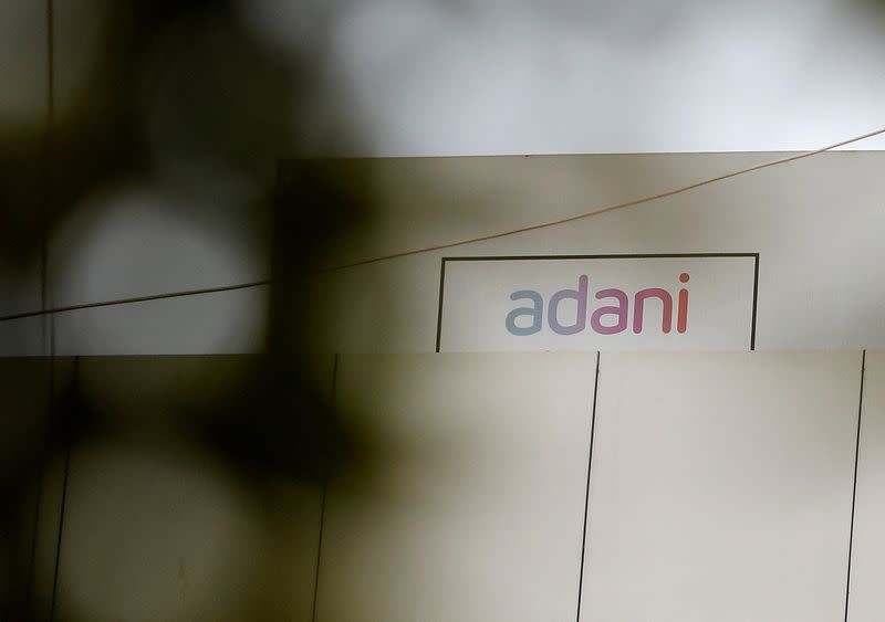 FILE PHOTO: The logo of the Adani Group is seen on one of its buildings in Ahmedabad