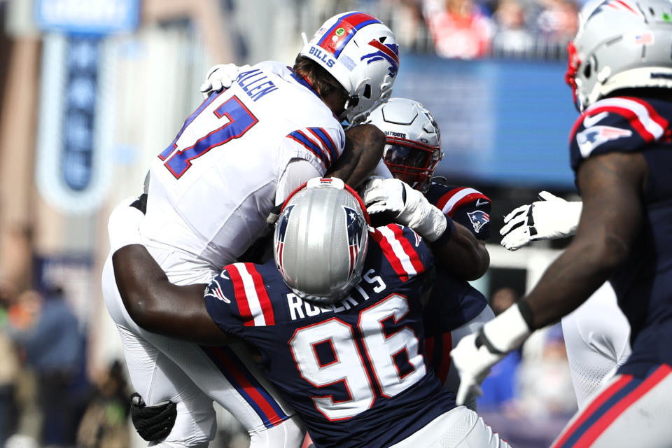 Buffalo Bills quarterback Josh Allen (17) is sacked by New England Patriots defensive tackle Sam Roberts (96) during the first half of an NFL football game, Sunday, Oct. 22, 2023, in Foxborough, Mass. (AP Photo/Winslow Townson)
