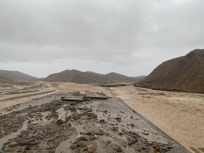 In this photo provided by the National Park Service, Mud Canyon Road is closed due to flash flooding in Death Valley, Calif., Friday, Aug. 5, 2022. Heavy rainfall triggered flash flooding that closed several Death Valley National Park roads on Friday near the California-Nevada line. The National Weather Service reported that all park roads had been closed after 1.46 inches of rain fell quickly. (National Park Service/Death Valley National Park via AP)
