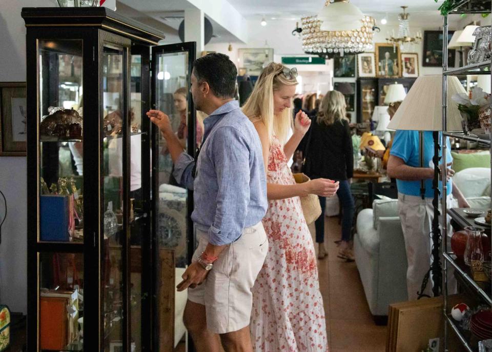 People shop for deals inside the Church Mouse Monday during the resale store's first day of business for the 2023-24 season.