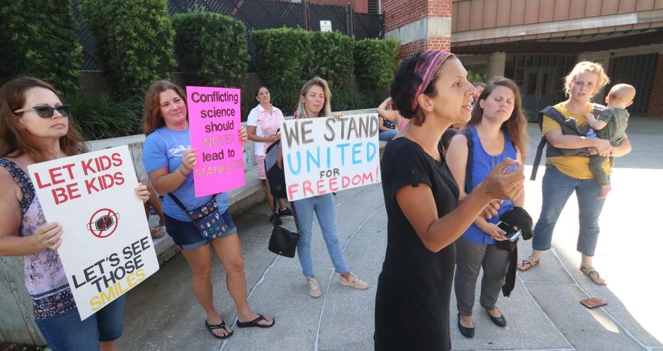 Rachael Cohen, a DeLeon Springs mother, speaks to a reporter Tuesday after she and other mothers were removed from the Volusia County School Board meeting as they protested school mask mandates.