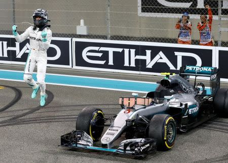 Formula One - F1 - Abu Dhabi Grand Prix - Yas Marina Circuit, Abu Dhabi, United Arab Emirates - 27/11/2016 - Mercedes' Formula One driver Nico Rosberg of Germany celebrates after winning the Formula One world championship. REUTERS/Ahmed Jadallah