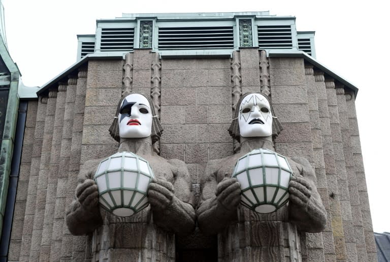 Statues painted with masks in tribute to rock band KISS at Helsinki's central station, pictured on April 28, 2017