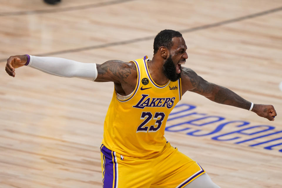 Los Angeles Lakers forward LeBron James celebrates during the second half in Game 4 of basketball's NBA Finals against the Miami Heat Tuesday, Oct. 6, 2020, in Lake Buena Vista, Fla. (AP Photo/Mark J. Terrill)