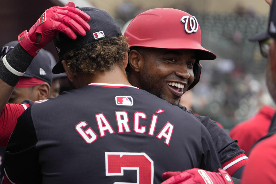 Washington Nationals' Victor Robles, right, is congratulated by teammate Luis Garcia Jr. after hitting a solo home run during the third inning of a spring training baseball game against the Miami Marlins Wednesday, March 6, 2024, in Jupiter, Fla. (AP Photo/Jeff Roberson)