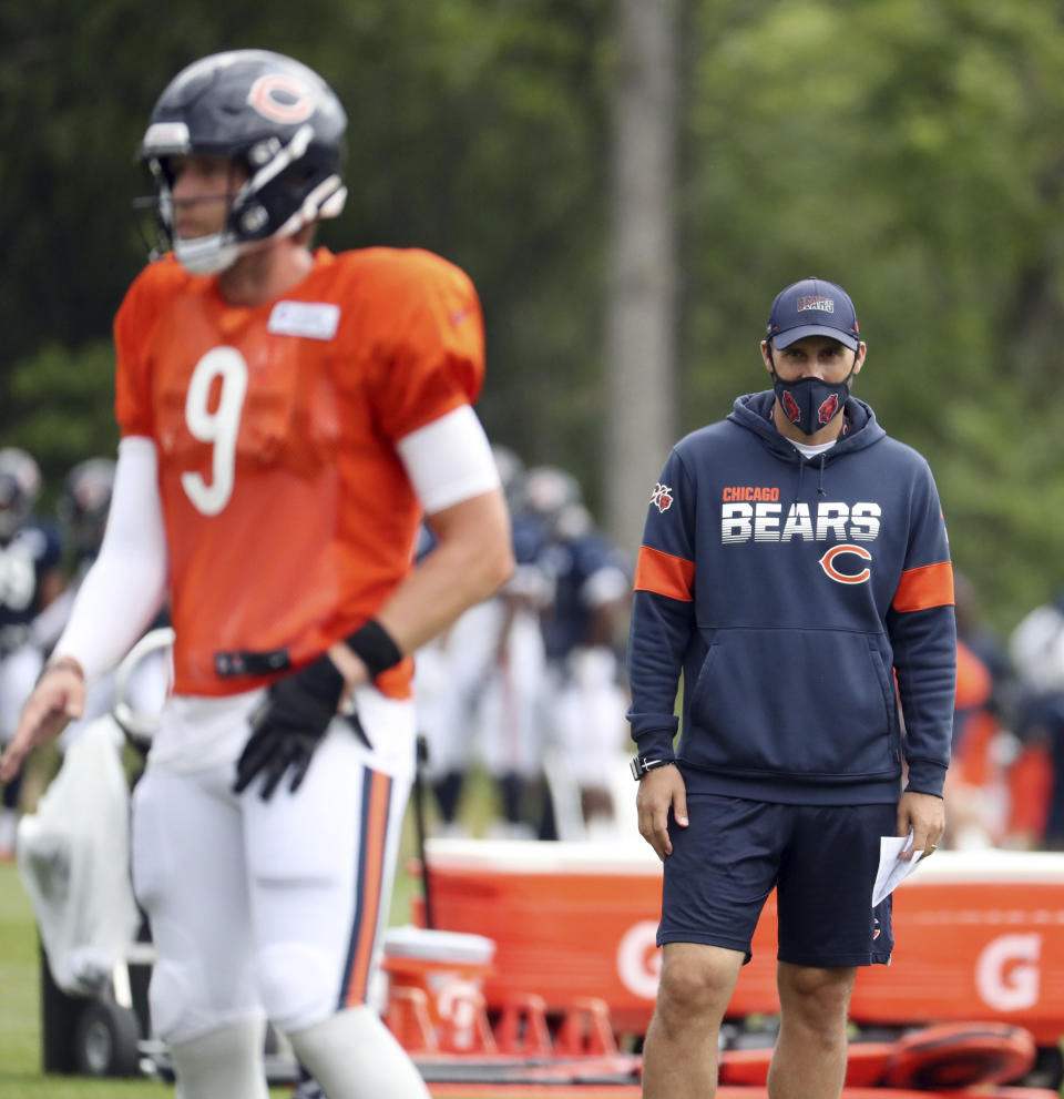 FILE - In this Aug. 25, 2020, file photo, Chicago Bears quarterbacks coach Dave Ragone watches quarterback Nick Foles (9) during NFL football training camp at Halas Hall in Lake Forest, Ill. Arthur Smith, the new Atlanta Falcons coach, has started building his staff by hiring offensive coordinator Dave Ragone, defensive coordinator Dean Pees and special teams coach Marquice Williams. (Brian Cassella/Chicago Tribune via AP, Pool, File)