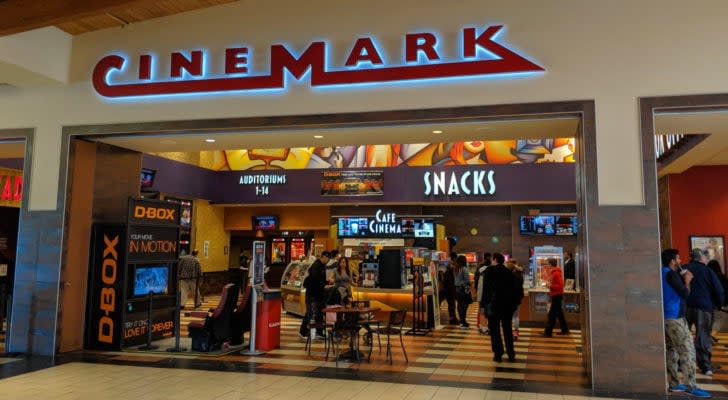 A Cinemark (CNK) movie theater with customers around the entrance