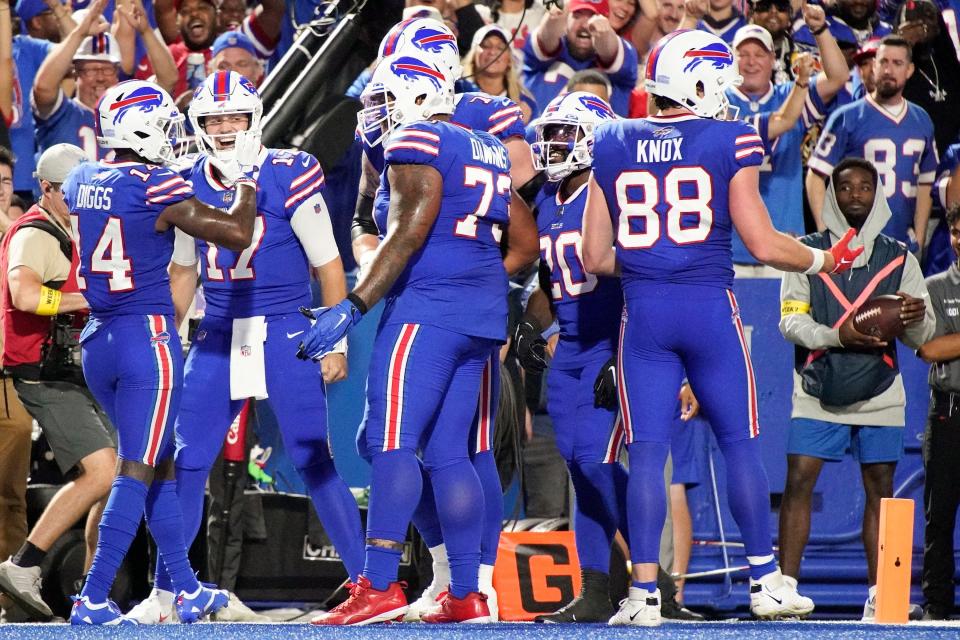 Bills wide receiver Stefon Diggs (14) and quarterback Josh Allen (17) celebrate a touchdown against the Titans at Highmark Stadium in Orchard Park, New York on Monday, Sept. 19.