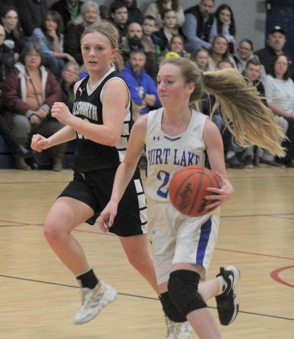 Burt Lake NMCA senior guard Brooke Ferraiuolo (23) and the Lady Eagles advanced to the district title game after earning a victory at Harbor Light on Wednesday.