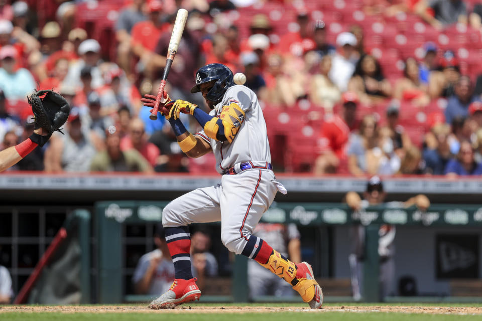 Atlanta Braves' Ronald Acuna Jr. reacts as he avoids a pitch during the fifth inning of a baseball game against the Cincinnati Reds in Cincinnati, Sunday, June 27, 2021. (AP Photo/Aaron Doster)