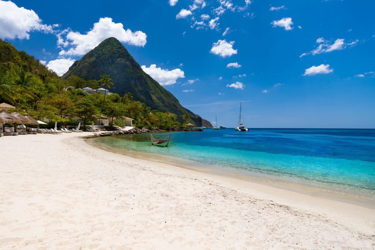 The Pitons dominate the skyline on the Caribbean island of Saint Lucia  (Getty Images)