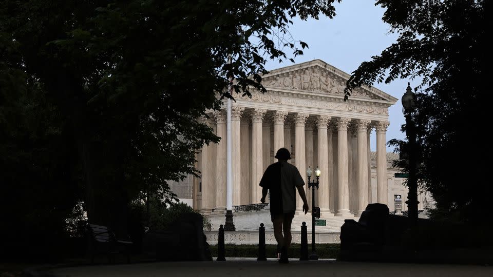 A pedestrian walks near the US Supreme Court building on June 5, 2023, in Washington. - Alex Wong/Getty Images