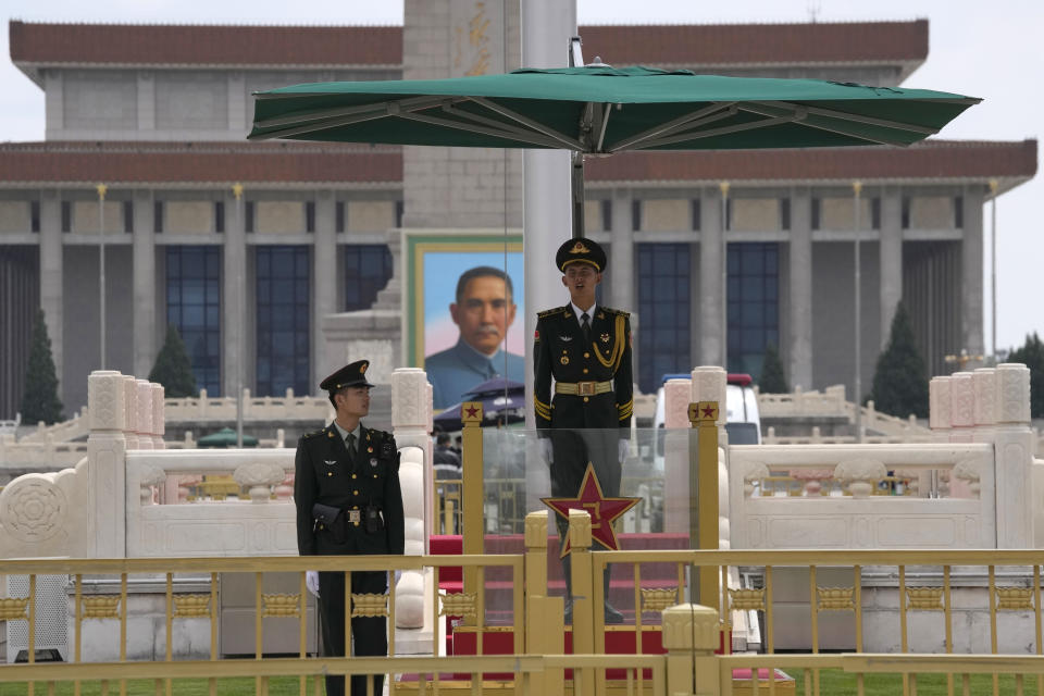 Members of a honor guard stand on duty near a portrait of Sun Yat-sen, who is widely regarded as the founding father of modern China, in Tiananmen Square on Thursday, April 28, 2022, in Beijing. With the May Day holidays just around the corner, Beijing has been tightening COVID-19 restrictions as it seeks to prevent a wider outbreak. (AP Photo/Ng Han Guan)