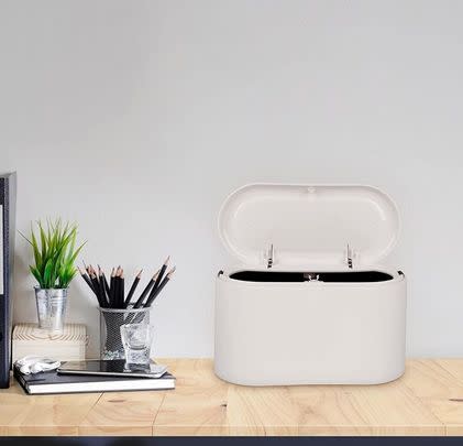 Buy the colleague who hates clutter this countertop trash can