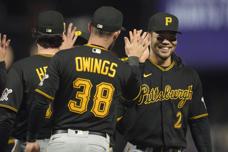 Pittsburgh Pirates' Chris Owings (38) and Connor Joe (2) celebrate with teammates after a win over the San Francisco Giants in a baseball game in San Francisco, Tuesday, May 30, 2023. (AP Photo/Jeff Chiu)