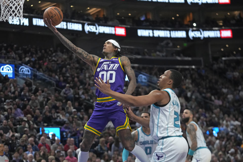 Utah Jazz guard Jordan Clarkson (00) goes to the basket as Charlotte Hornets guard Grant Williams (2) defends during the first half of an NBA basketball game Thursday, Feb. 22, 2024, in Salt Lake City. (AP Photo/Rick Bowmer)