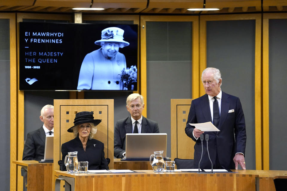 King Charles III, right, speaks with Camilla the Queen Consort at left, after receiving a Motion of Condolence at the Senedd, following the death of Queen Elizabeth II, in Cardiff, Friday, Sept. 16, 2022. King Charles III and Camilla, the Queen Consort, arrived in Wales for an official visit. The royal couple previously visited to Scotland and Northern Ireland, the other nations making up the United Kingdom, following the death of Queen Elizabeth II at age 96 on Thursday, Sept. 8. (Andrew Matthews/Pool Photo via AP)