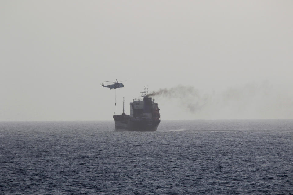 In this Wednesday, Aug. 12, 2020 photo, released by the U.S. Navy, the MT Wila is boarded by Iranian navy commandos in the Gulf of Oman off the eastern coast of the United Arab Emirates. The Iranian navy boarded and briefly seized the Liberian-flagged oil tanker near the strategic Strait of Hormuz amid heightened tensions between Tehran and the U.S., a U.S. military official said Thursday, Aug. 13, 2020. (U.S. Navy via AP)