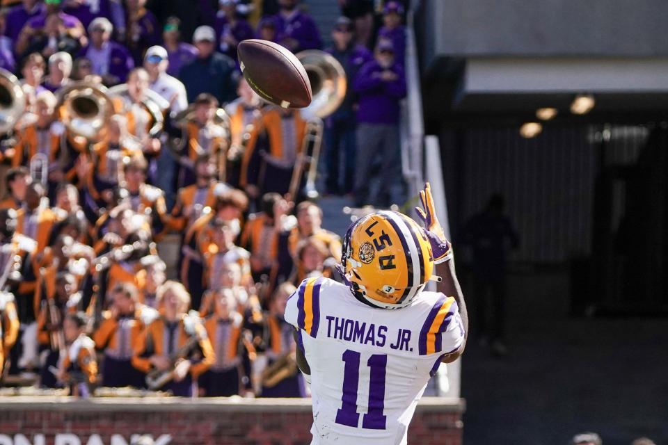 Oct 7, 2023; Columbia, Missouri, USA; LSU Tigers wide receiver Brian Thomas Jr. (11) catches a pass for a touchdown against the Missouri Tigers during the second half at Faurot Field at Memorial Stadium. Mandatory Credit: Denny Medley-USA TODAY Sports