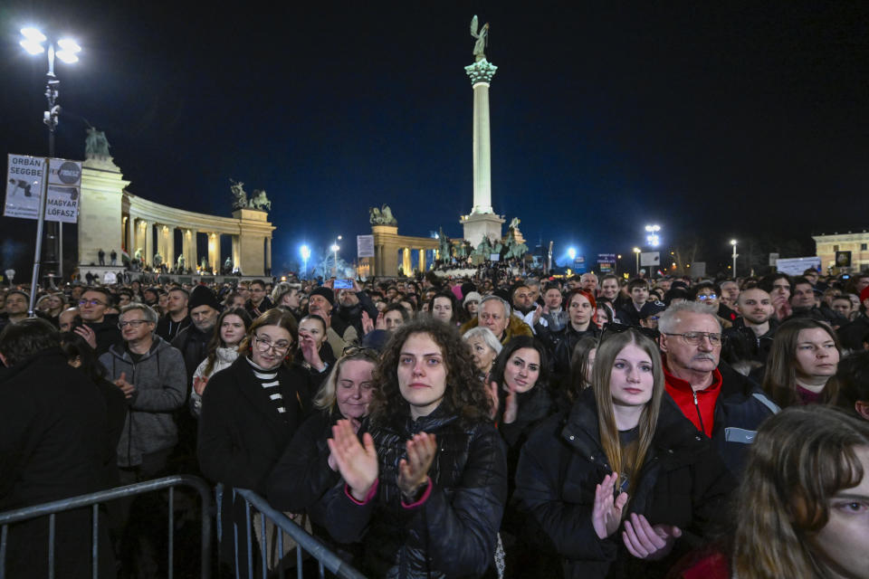 People stage a protest, at Heroes' Square in Budapest, Hungary, Friday, Feb. 16, 2024. Protesters demand a change in the country's political culture after the conservative head of state resigned amid scandal over a presidential pardon. (AP Photo/Denes Erdos)