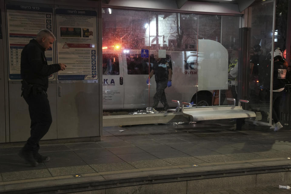 The body of a suspected Palestinian attacker lies in a light rail train station after a stabbing in Jerusalem, Wednesday, Aug. 30, 2023. Israeli police said a Palestinian assailant stabbed an Israeli man near a light-rail station before the attacker was shot and killed by police. Israeli paramedics said the Israeli man was moderately wounded, and pronounced the attacker dead. (AP Photo/Mahmoud Illean)