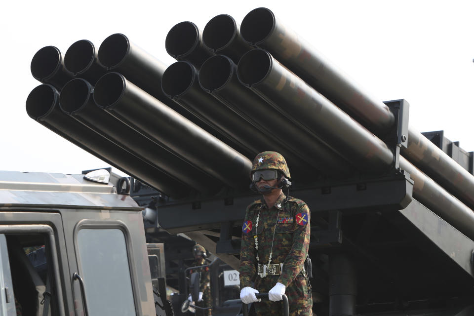 Military officer stands atop trucks loaded with missiles during a parade to commemorate Myanmar's 78th Armed Forces Day in Naypyitaw, Myanmar, Monday, March 27, 2023. (AP Photo/Aung Shine Oo)