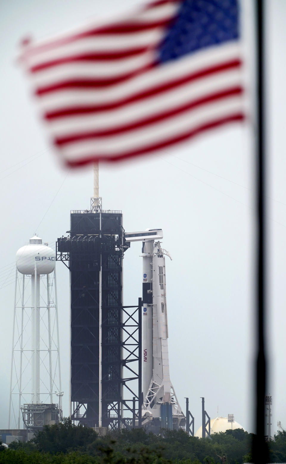 The SpaceX Falcon 9, with the Crew Dragon spacecraft on top of the rocket, sits on Launch Pad 39-A Monday, May 25, 2020, at Kennedy Space Center, Fla. Two astronauts will fly on the SpaceX Demo-2 mission to the International Space Station scheduled for launch on May 27. (AP Photo/David J. Phillip)