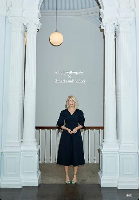 holly willoughby wearing black dress and green sandals